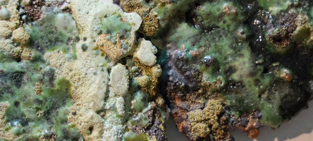 A picture of some white, green and brown mineral-like material